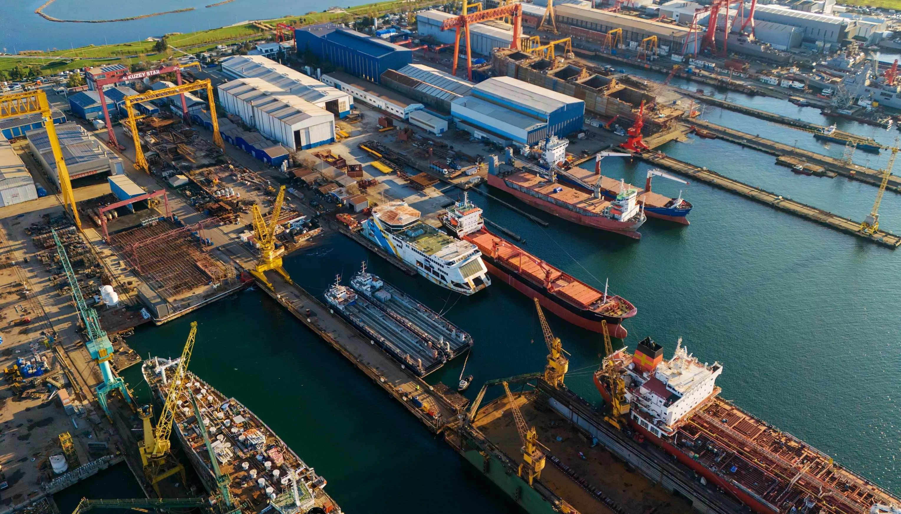 Drone view of a crowded industrial pier with multiple ship